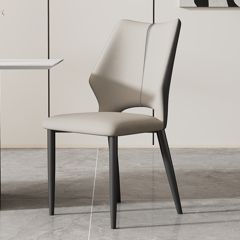 Minimalist Italian-style upholstered dining chair with soft backrestThis soft cushioned dining chair features Italian-inspired curves, fabric upholstery, and sleek metal legs, offering a blend of luxury and comfort for restaurants, cafes, and living spaces.