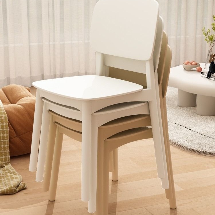 Modern minimalist plastic dining chair with ergonomic backrest in cream color