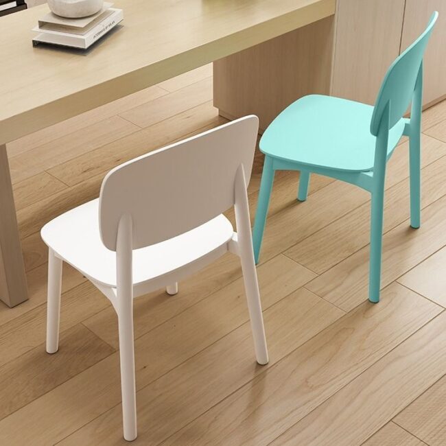 Modern minimalist plastic dining chair with ergonomic backrest in cream color