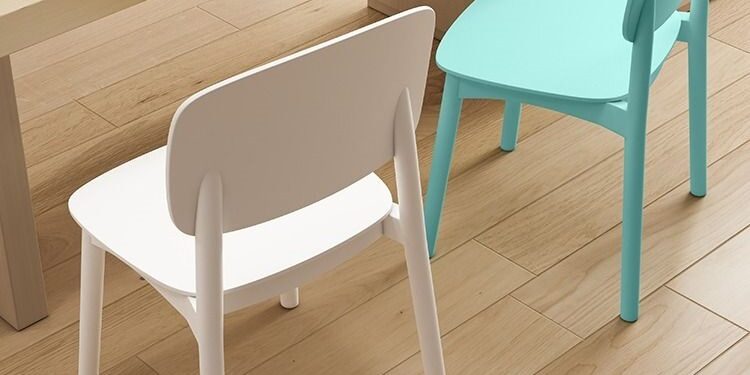 Modern minimalist plastic dining chair with ergonomic backrest in cream color