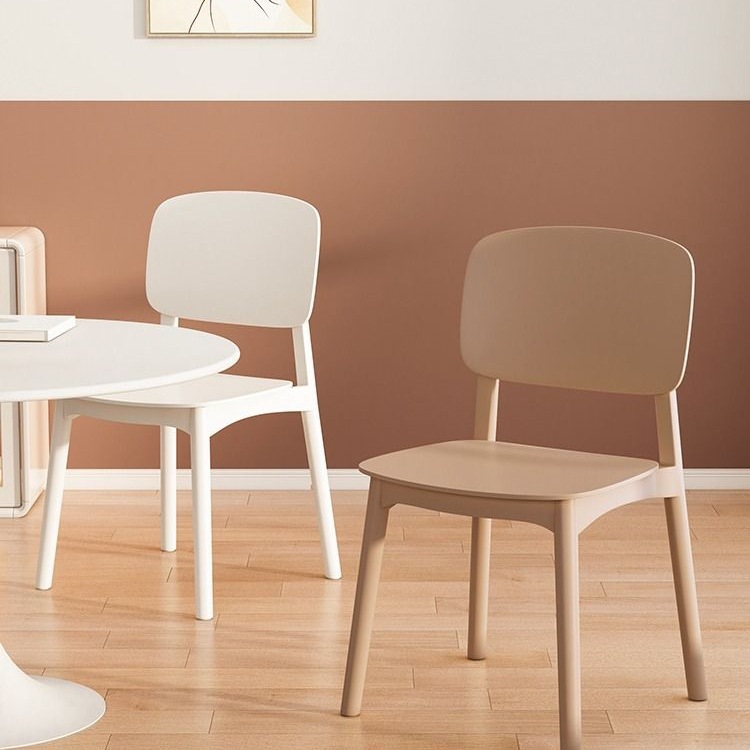 Modern minimalist plastic dining chair with ergonomic backrest in cream color