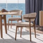 Nordic solid wood dining chair with cotton linen fabric and ergonomic horn-shaped backrest
